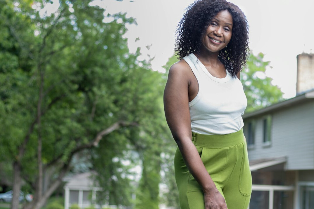 confident person smiling outdoors