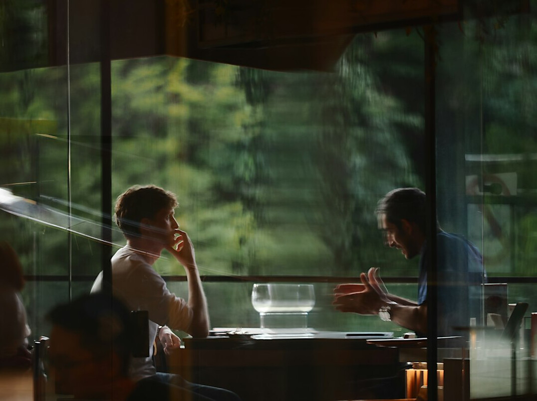 people having conversation at table