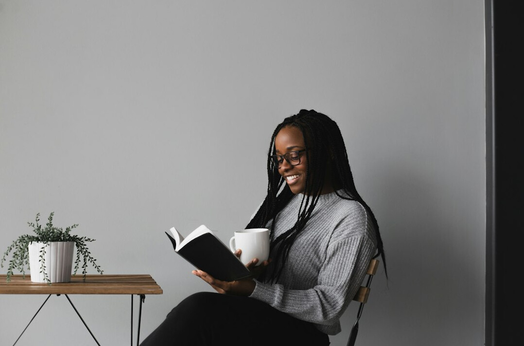 person reading self help book