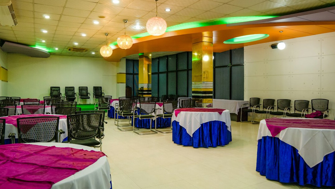 Bright empty meeting room with large windows and a round table